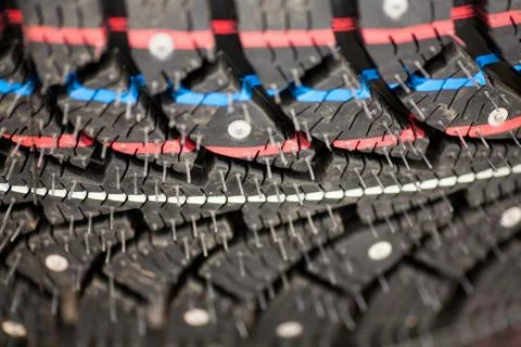 Studded tire on a background close-up Stock Photos
