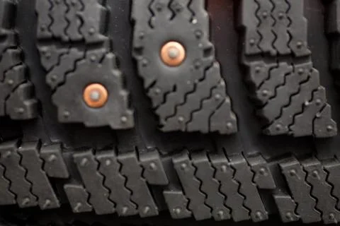 Studded tire on a background close-up Stock Photos