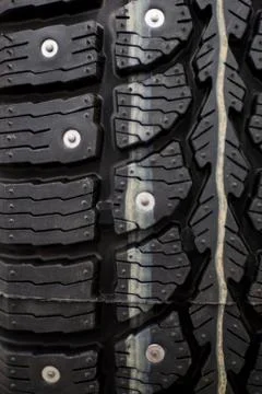 Studded tire on a background close-up Stock Photos