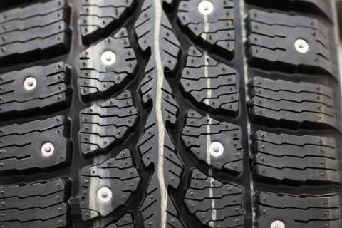 Studded tire on a background close-up Stock Photos
