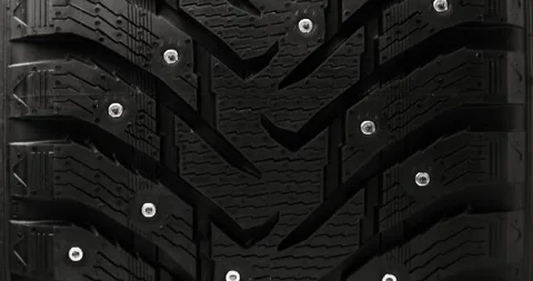 Studded winter tire background Stock Footage 320971634