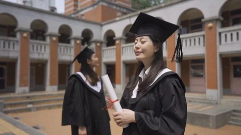 Student academic gown posing positively outdoor Video stock 110906366