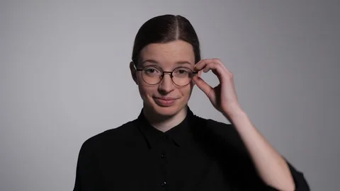 Student adjusts glasses Stock Footage 105392686