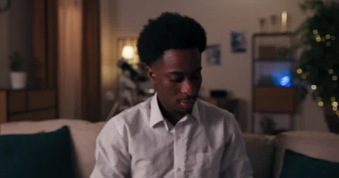 Student of African appearance is going to party. The guy is wearing white shirt Stock Footage 218033025
