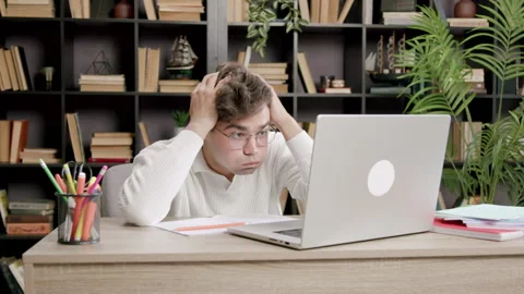 Student amazed and upset when he saw how much information and materials he has Stock Footage 317704393