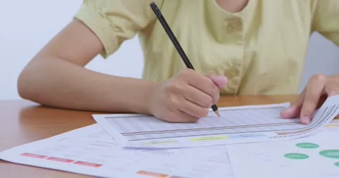 Student analyzing data metrics classroom educational material indoor close-up Stock Footage 312928516