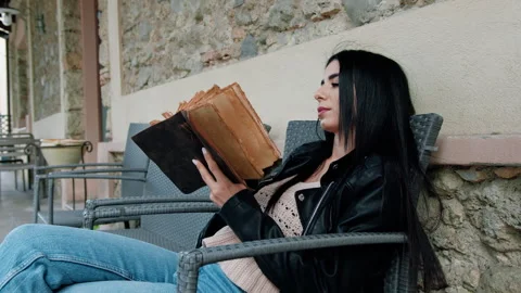Student Analyzing An Old Book Stock Footage 276510553