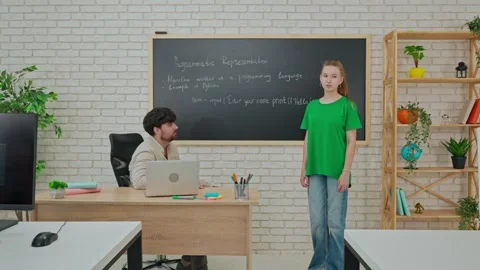 Student and Instructor Discuss Python Code in Modern Classroom Stock Footage 281072223