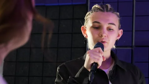 Student and instructor engage in focused vocal sessions Video stock 307029199