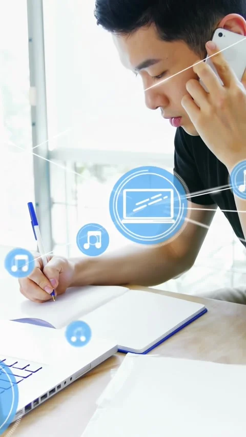 Student answering phone while taking notes for tech multitasking, blue icons Stock Footage 331008934