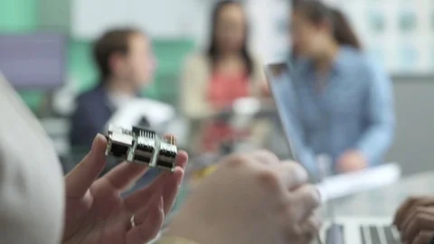 Student attaching USB cable to circuit board in classroom Stock Footage