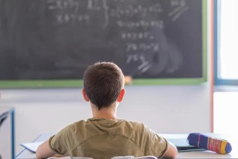 Student attending in a  classroom during a lesson Stock Photos