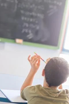 Student attending in a  classroom during a lesson Stock Photos