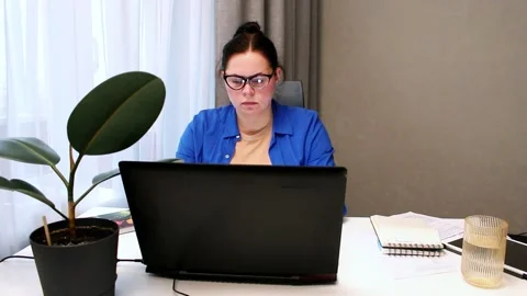 Student attending virtual university class via video conference. Young woman Stock Footage 327861419