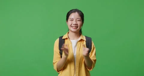 Student With A Backpack  Books Smilin While Standing In The Green Screen Video stock 243420547