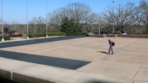 Student with Backpack Walking Across McLendon Quadrangle Stock Footage 69231825