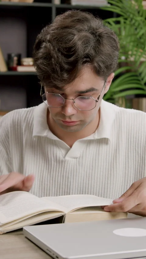 Student boy absorbed in studies, doing his homework, preparing for university Stock Footage 316606922