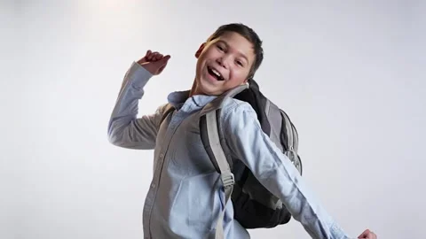 Student boy with bag jumping Stock Footage 237430814