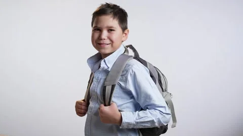 Student boy with bag on white background Stock Footage 241023608