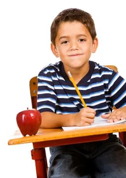 Student: boy doing homework at desk Stock Photos