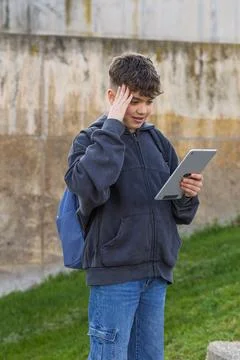 Student boy having a problem while using digital tablet Stock Photos