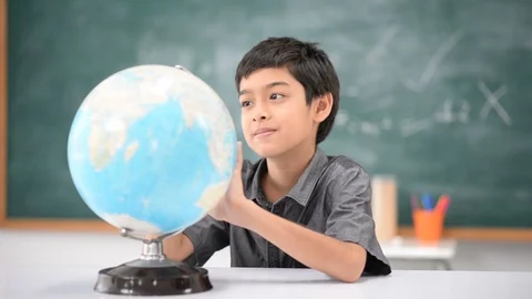 Student boy learning geography earth map in the classroom Stockbeeldmateriaal 105207962