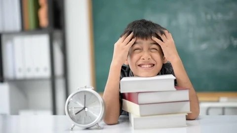 Student boy study hard with a lot of books Stockbeeldmateriaal 105273129