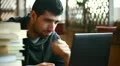 Student boy writing and chatting on notebook HD Footage