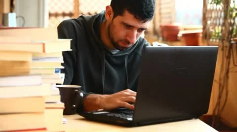Student boy writing and chatting on notebook Stock Footage 10895332