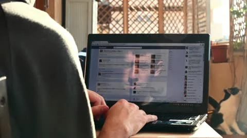 Student boy writing and chatting on Facebook Stock Footage