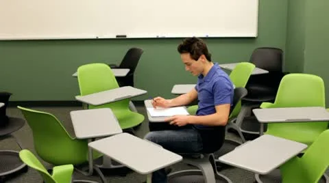 Student breaks away from chairs Stock-Footage 10699525