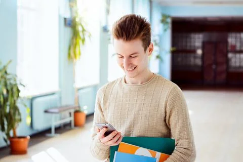 Student browsing his phone Stock Photos