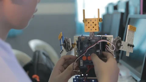 Student building a robot Stock Footage 87686191
