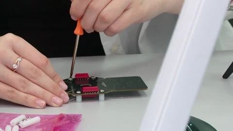 A student builds an electronic board for a drone Video stock 310032897