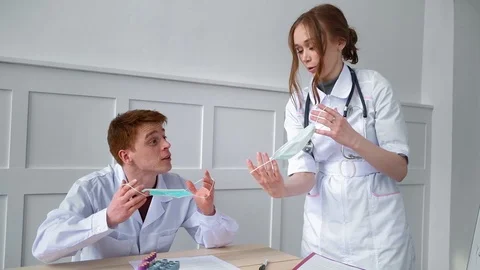 Student can argue about purpose of masks for protection against viral diseases Stock Footage 127513964