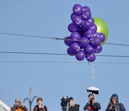 Student cap flying supported by balloons Stock Photos