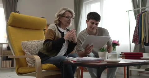 Student caucasian man study with help of his tutor professor or mother Stock Footage 267486729