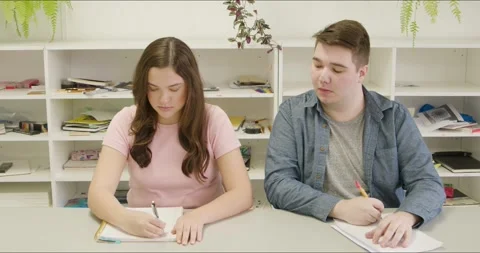 Student Cheating on Test in Class. Jock Athlete Type Failing Mid Term Final Stock Footage 295633355
