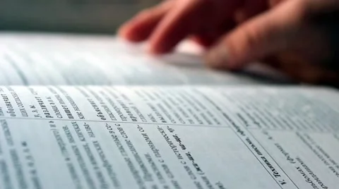 Student checking a book Stock Footage 45288509