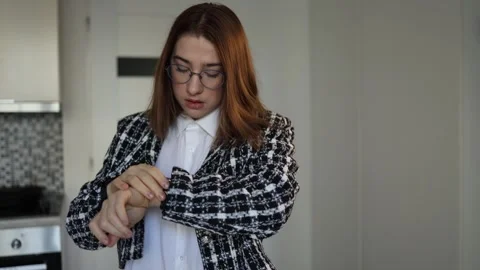 Student checking watch while rushing to leave for class Stock Footage 327217049