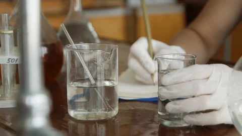 Student chemist do work and experiments during a college lecture. Close up. 스톡 동영상 113347482