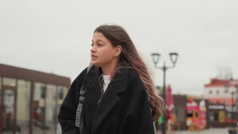 Student in city during cloudy weather. Casual profile of young urban student Stock Footage 334061621