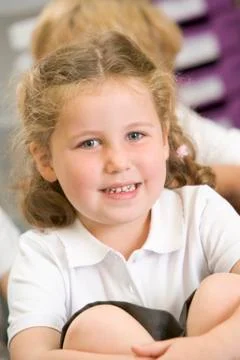 Student in class sitting on floor (selective focus) Stock Photos