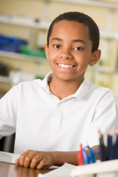 Student in class taking notes Stock Photos