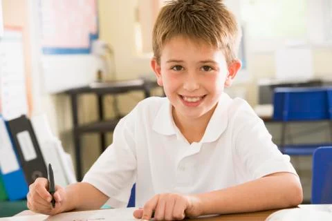Student in class taking notes Stock Photos