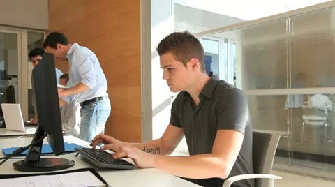 Student in classroom calling teacher for help Stock Footage 14827094