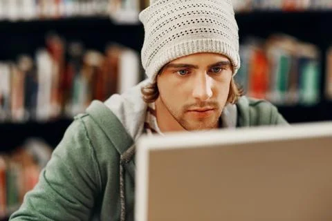 Student, computer and learning in college library for programming course Stock Photos