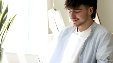 Student with computer or laptop at the desk with successful expression Stock Footage 255708020