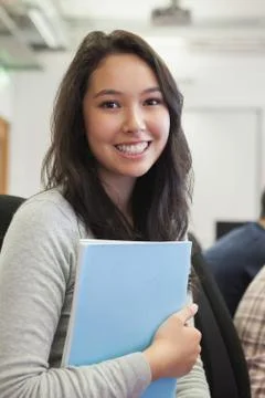 Student in a computer room holding a folder Stock Photos