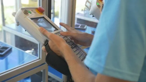 Student Controlling &amp; Programming Robotic Arm, Slow Motion Stock Footage 124342692